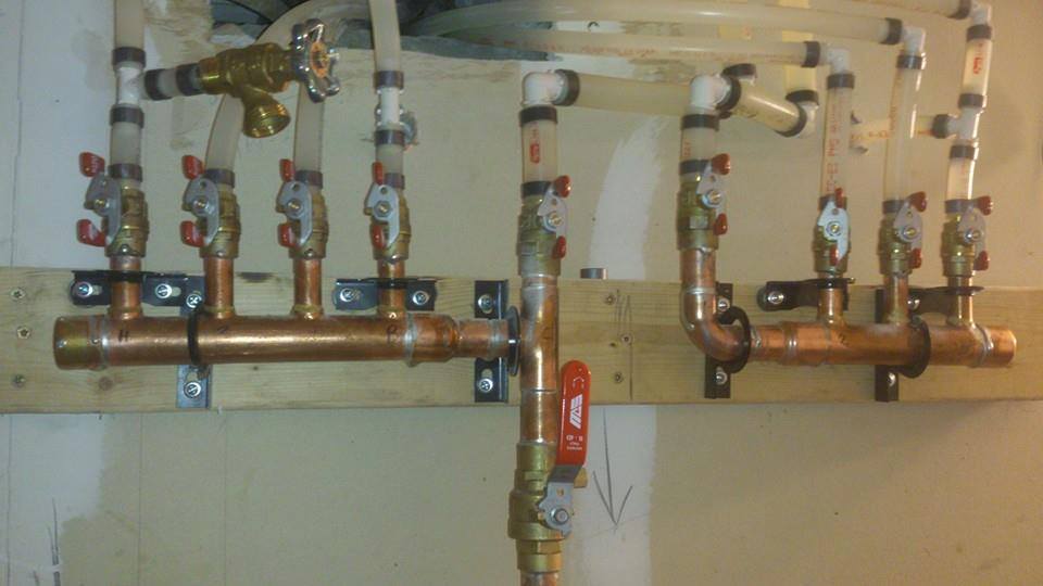 Manifold system for three apartments with individual shut off valves for each unit.